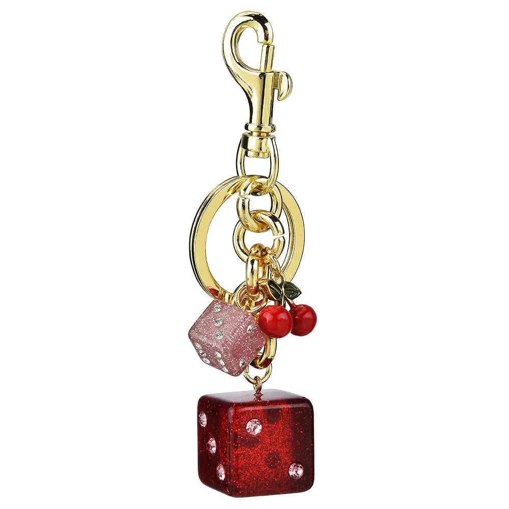 Square metal keychain pendant with a vintage cherry two-tone dice pattern and electroplated finish.
