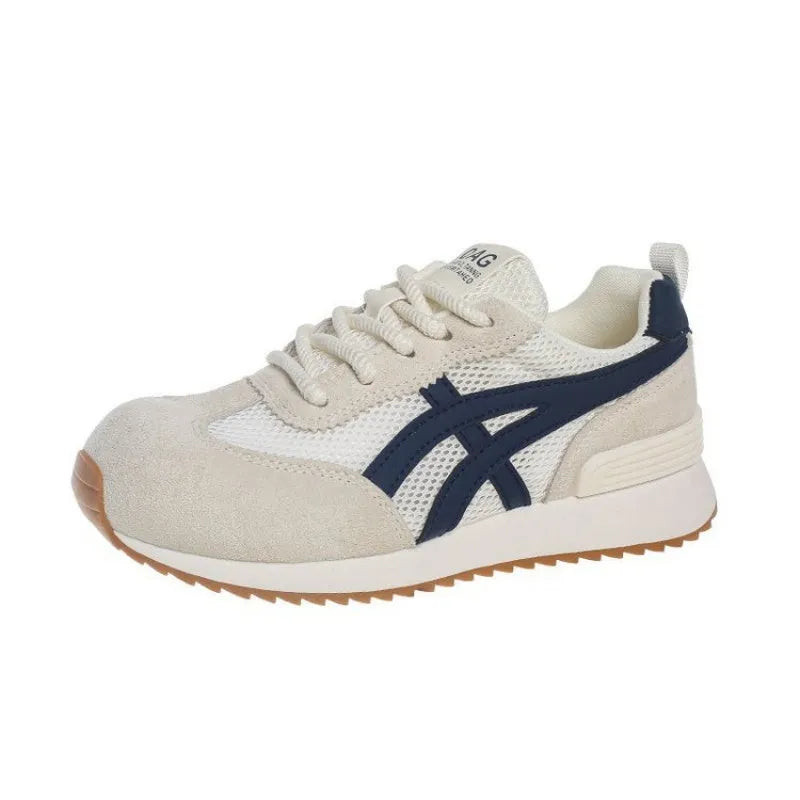 Women's white low-top lace-up sneakers with round toe on a flat plastic sole.
