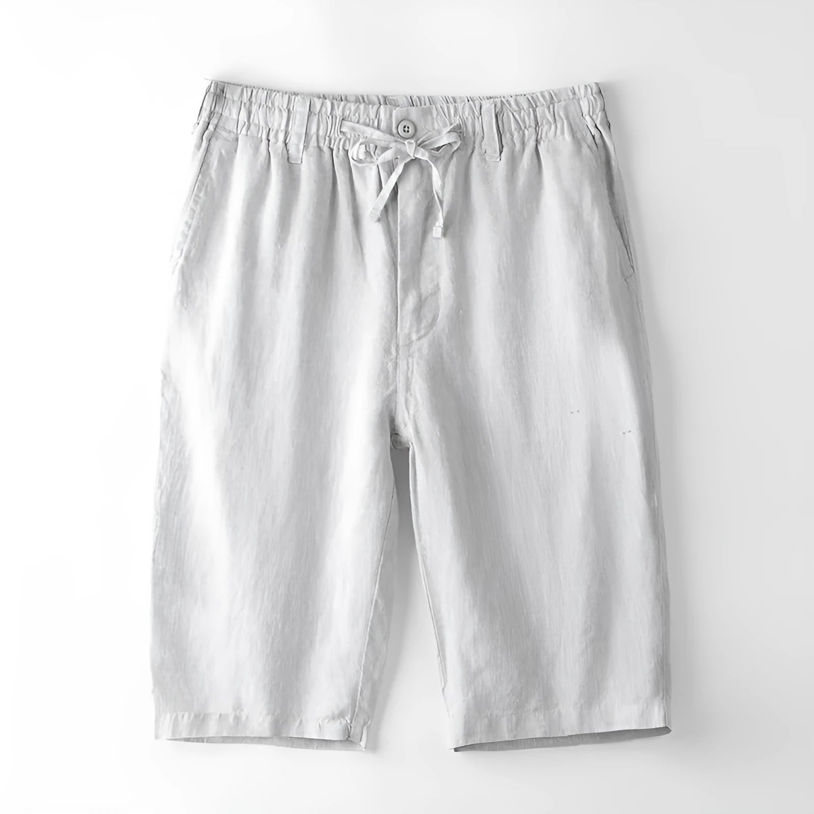 Men's loose-fit linen capri trousers in a straight leg style on a hanger.