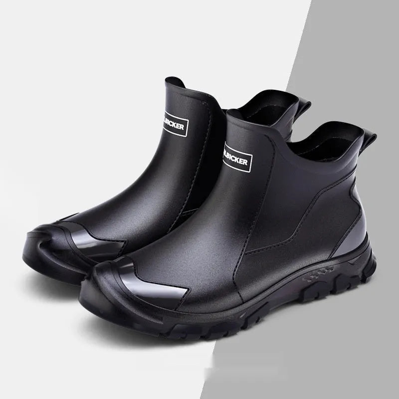 Short tube PVC rain boot in black and red with round toe and flat non-slip sole.