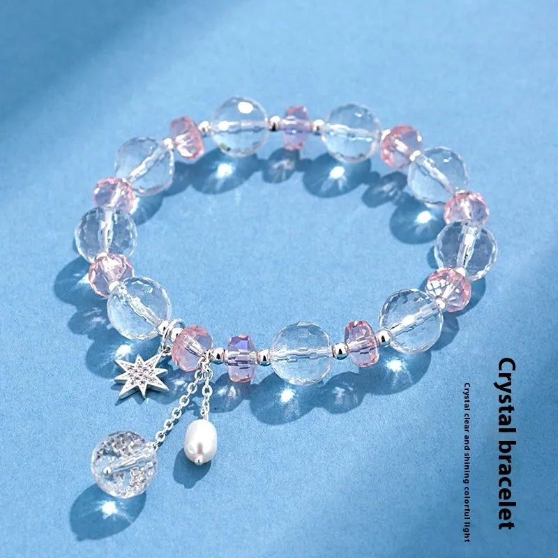 Women's white crystal bracelet with diamond-shaped beads and lucky cat charm