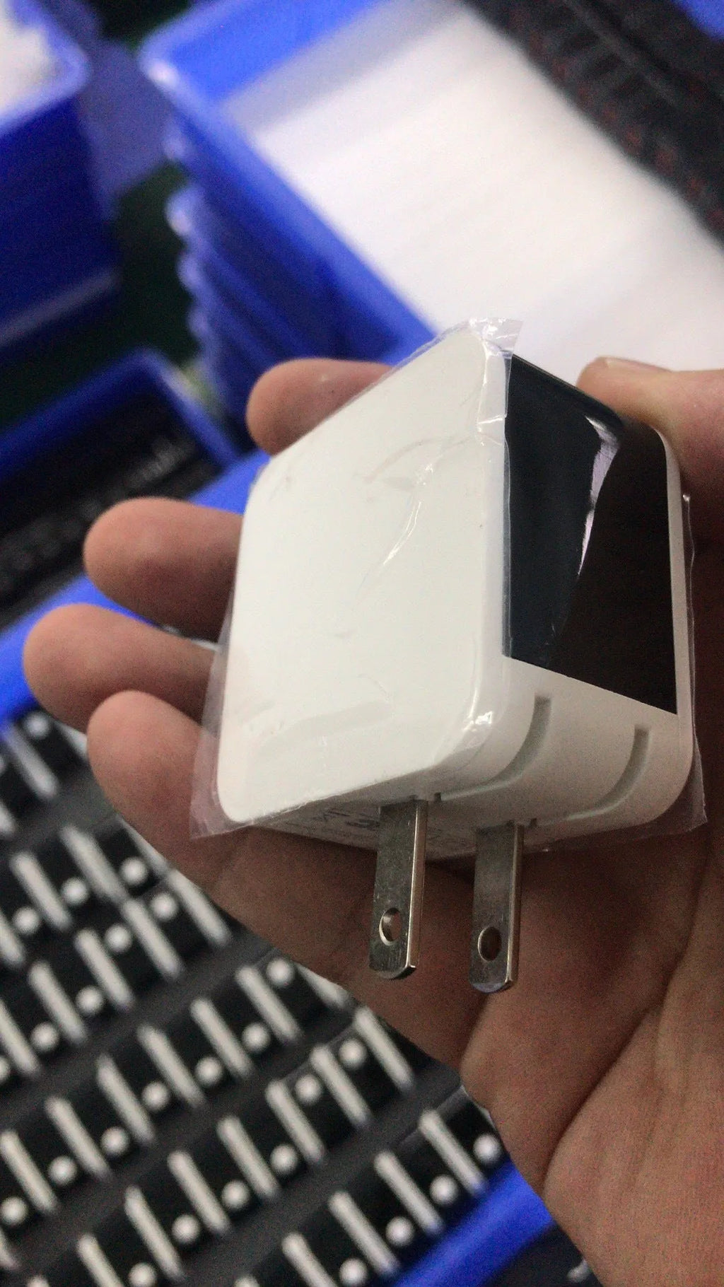 Black 5V2.4A USB travel charger with dual ports and a digital display screen, shown with a US plug.