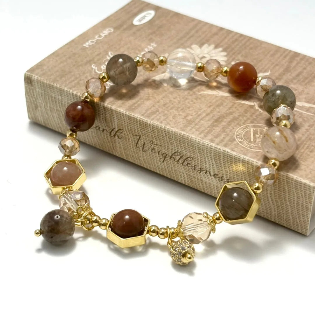 Gold citrine crystal bracelet with hand-woven construction showing auspicious Chinese symbols