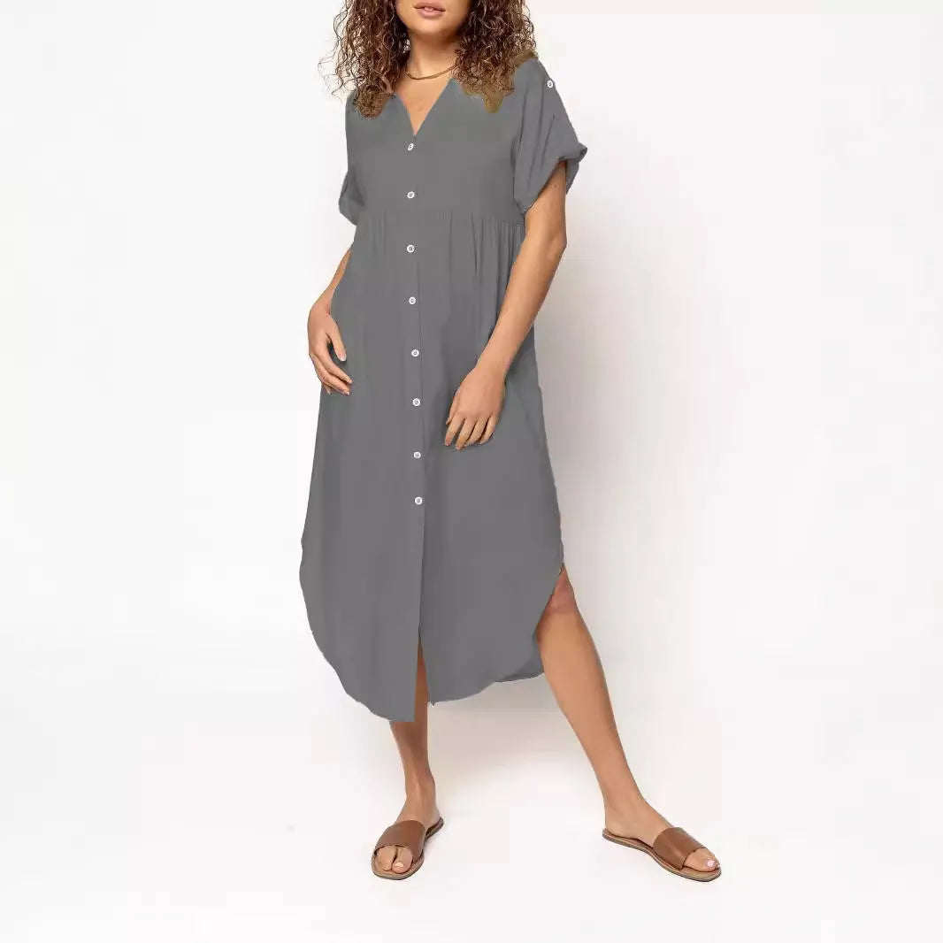 A solid colour mid-length casual dress with a button-down front and regular sleeves on a hanger.