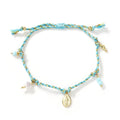 Close-up of a hand-woven ethnic style bracelet for women made from colourful braided rope, showing the strap tag detail.