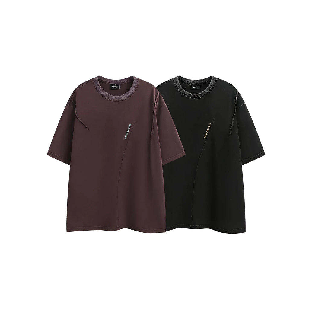 Purple loose-fit short-sleeved cotton t-shirt featuring an embroidered retro pattern on the chest.