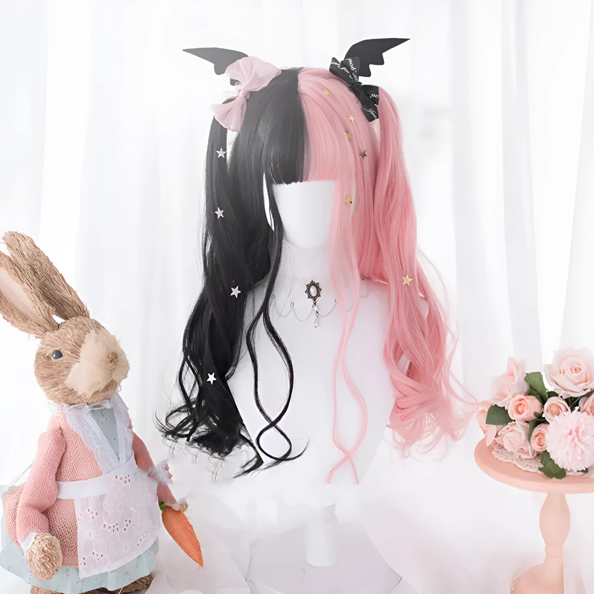 Long curly black and pink synthetic Lolita wig with bangs, styled for Harajuku cosplay.
