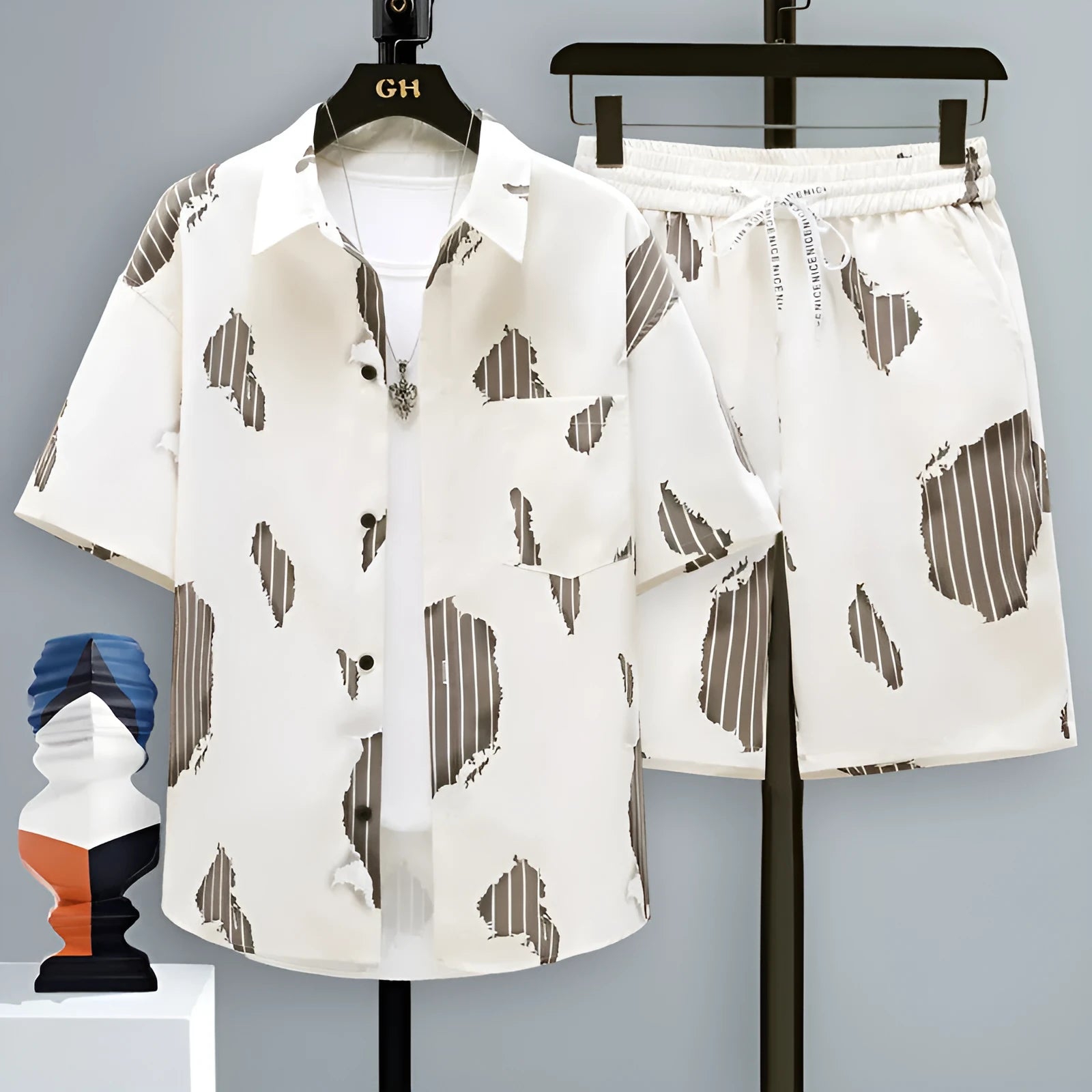 Men's casual sports shorts two-piece set in polyester, showing short sleeve top and elasticated shorts.