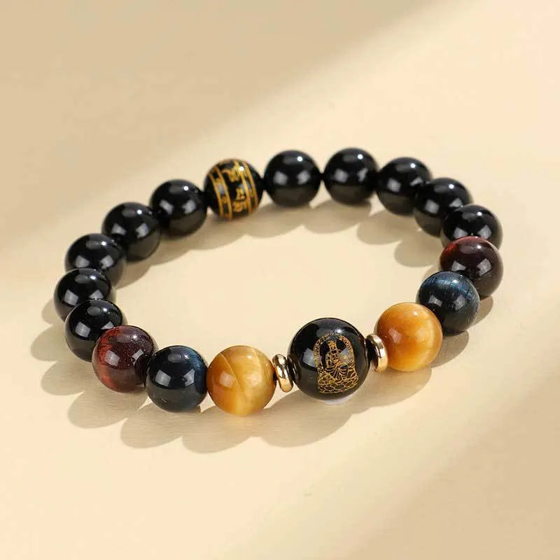 Manually crafted black agate beaded bracelet with gold, blue, and red tiger eye stones, showing ethnic zodiac design.