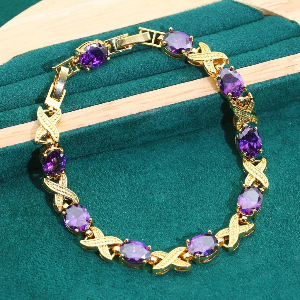 18k gold-plated zircon jewellery set showing ring, earrings, bracelet and necklace with multi-colour stones.