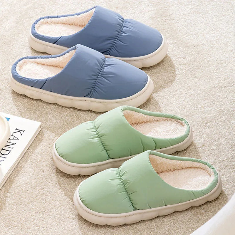 Blue down cotton slippers with thick rubber sole and plush lining, shown from side.