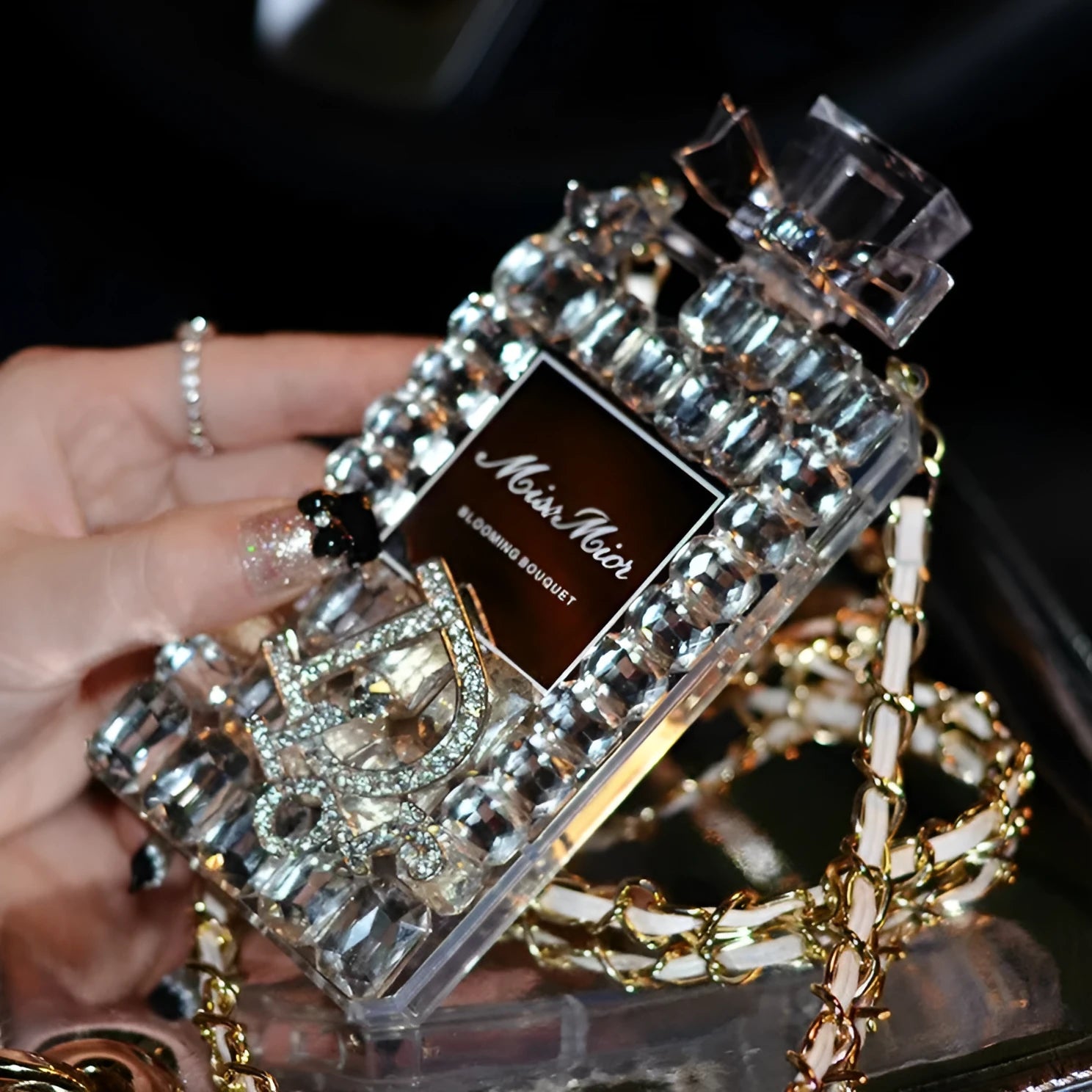 Perfume bottle bow design iPhone case with metal chain in black, gold, pink, or transparent colour