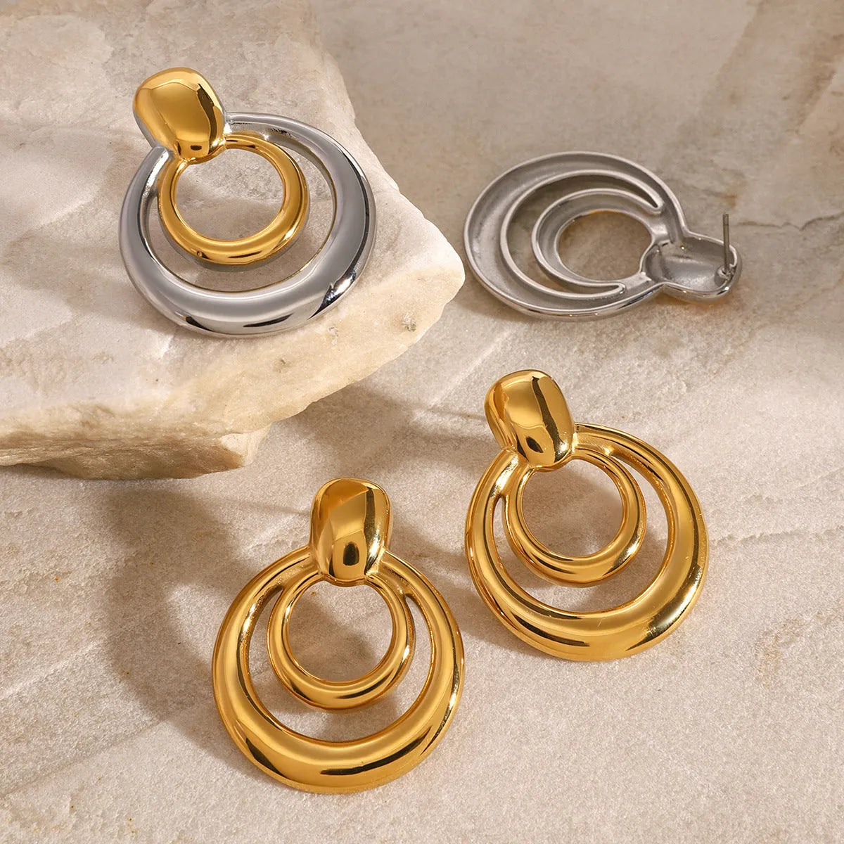 Gold geometric round stud earrings with double-layer hollow design on titanium steel posts