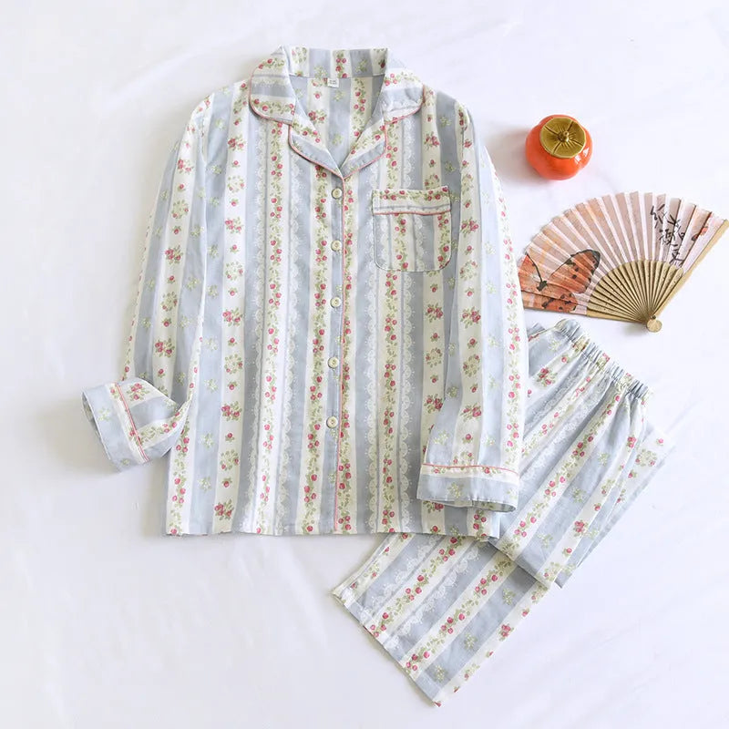 Women's red fruit print cotton gauze long-sleeved top and trousers two-piece lounge set laid flat.