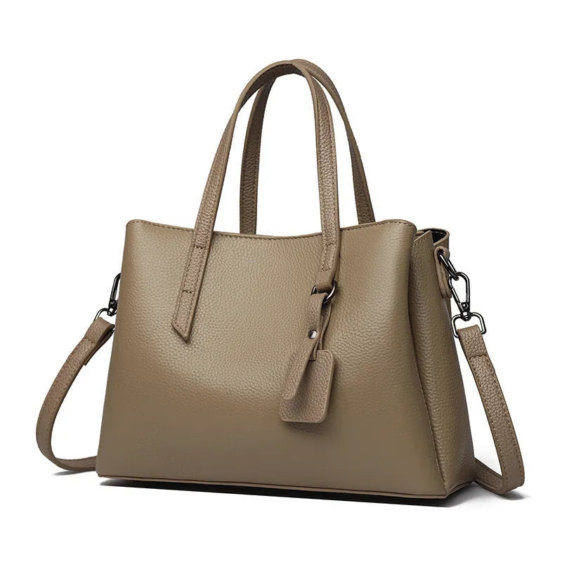 Women's cowhide leather shoulder handbag in horizontal square shape with contrast stitching