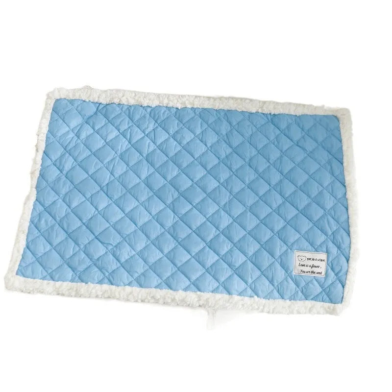 Blue quilted pet blanket for cats showing terry texture and 80x60cm large size dimensions