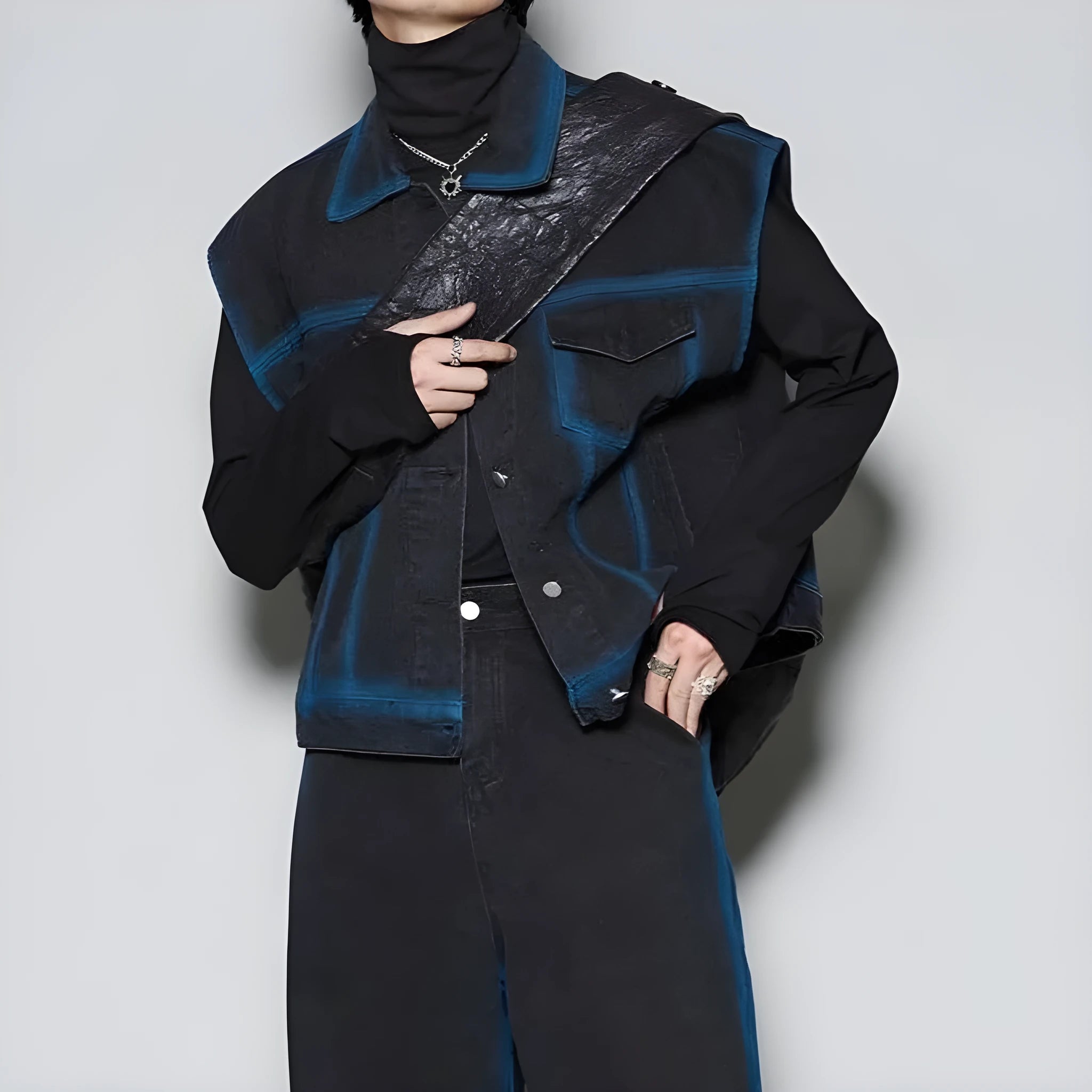Blue distressed denim fleece-lined vest and jeans two-piece suit on a model, showing spray colour gradient detail.