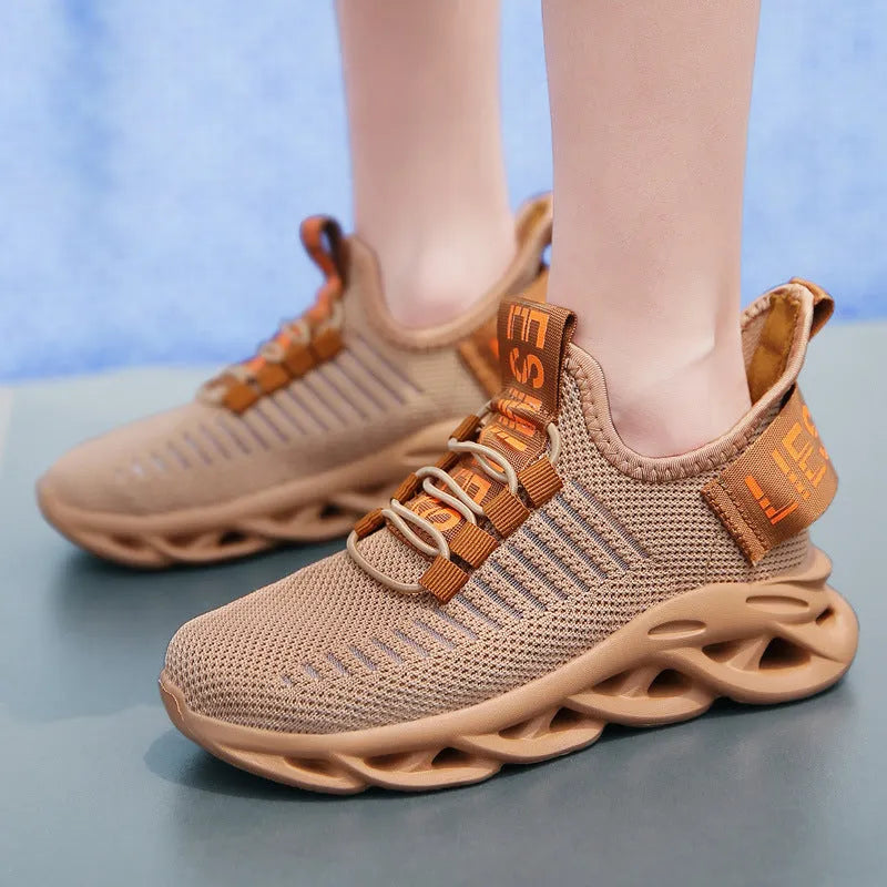 Kids coconut sneakers in black with Velcro strap and fabric upper
