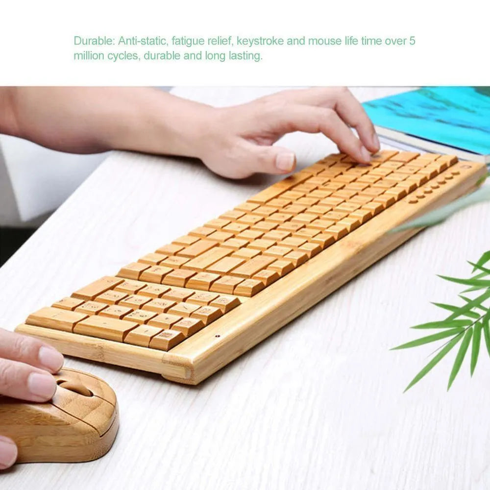 Bamboo wireless keyboard and mouse set with natural wooden finish on a desk