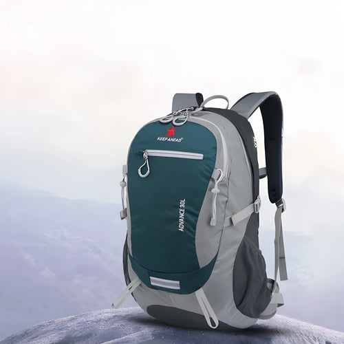 30 litre nylon waterproof backpack in dark green with airpillow straps, shown from the back.