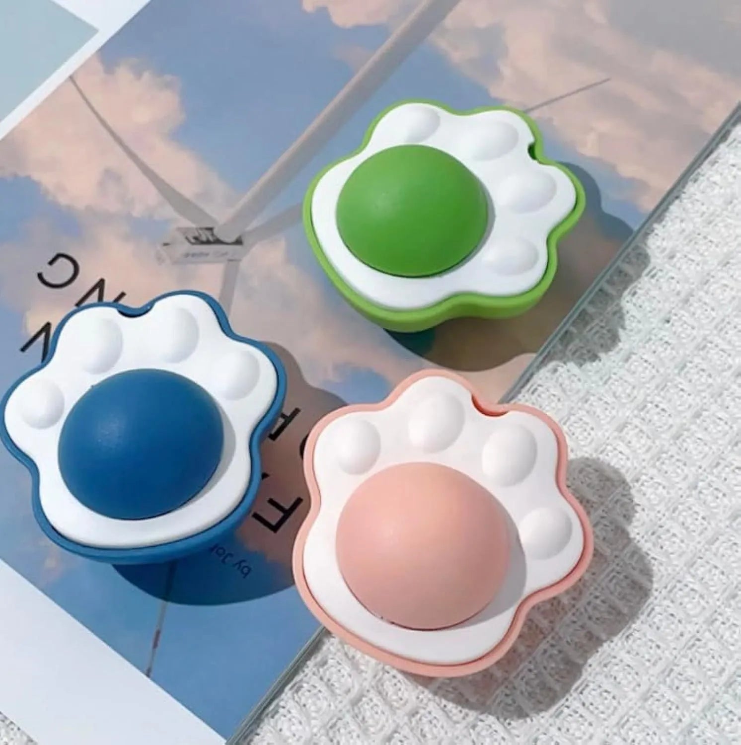 Blue, green and pink catnip ball toys for interactive play and dental cleaning