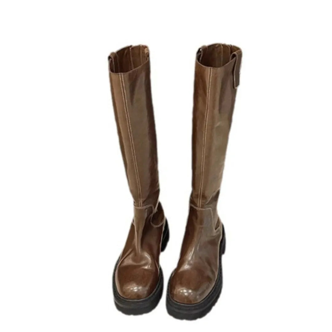 Black and brown women's long tube knight boots with chunky heel and back zipper.