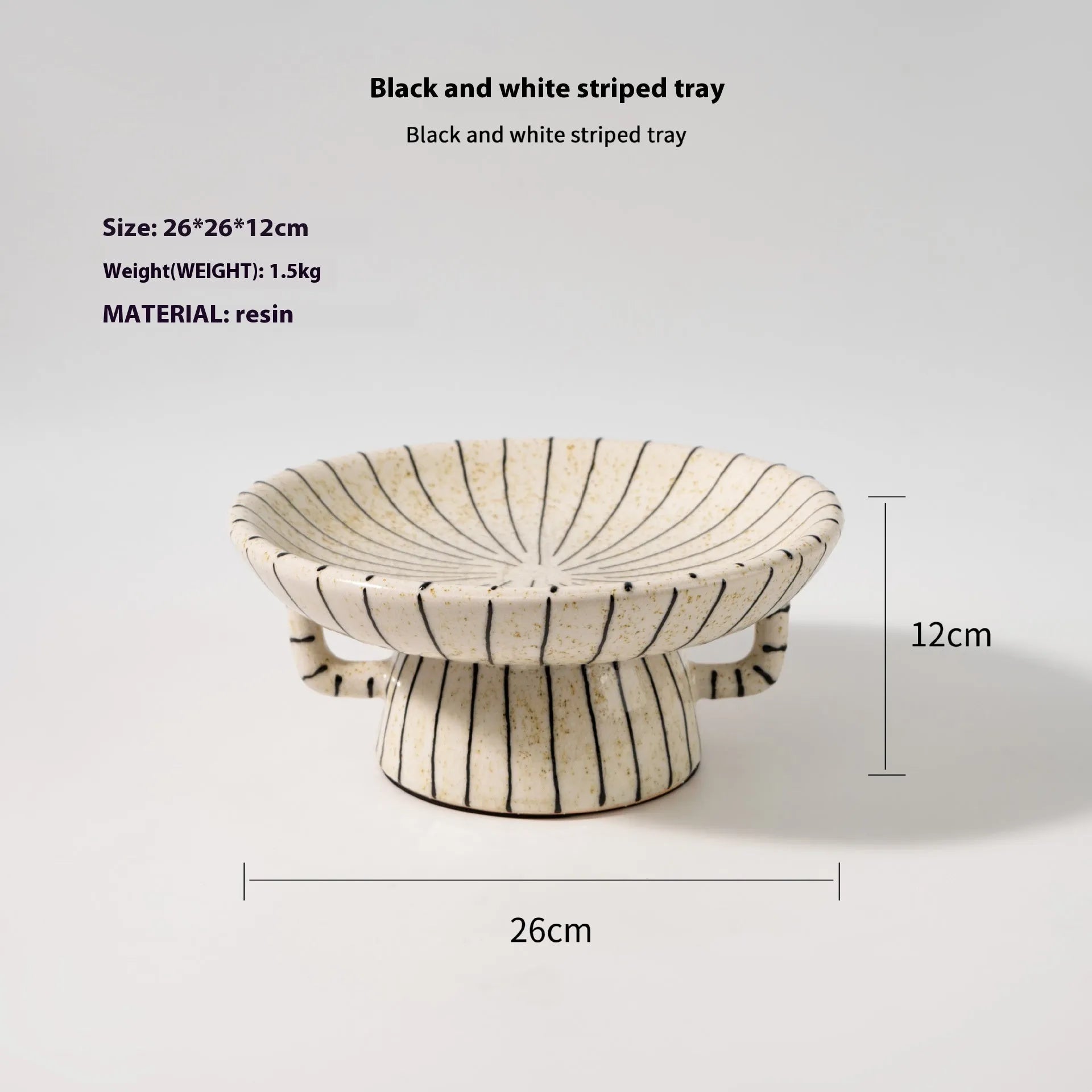 Black and white striped synthetic resin fruit dessert plate on a table