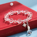 Women's white crystal bracelet with diamond-shaped beads and lucky cat charm