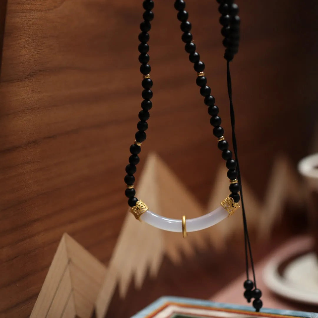 Frosted black agate pendant necklace with white chalcedony detailing on 925 silver chain