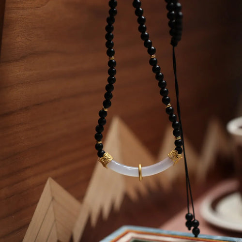 Frosted black agate pendant necklace with white chalcedony detailing on 925 silver chain
