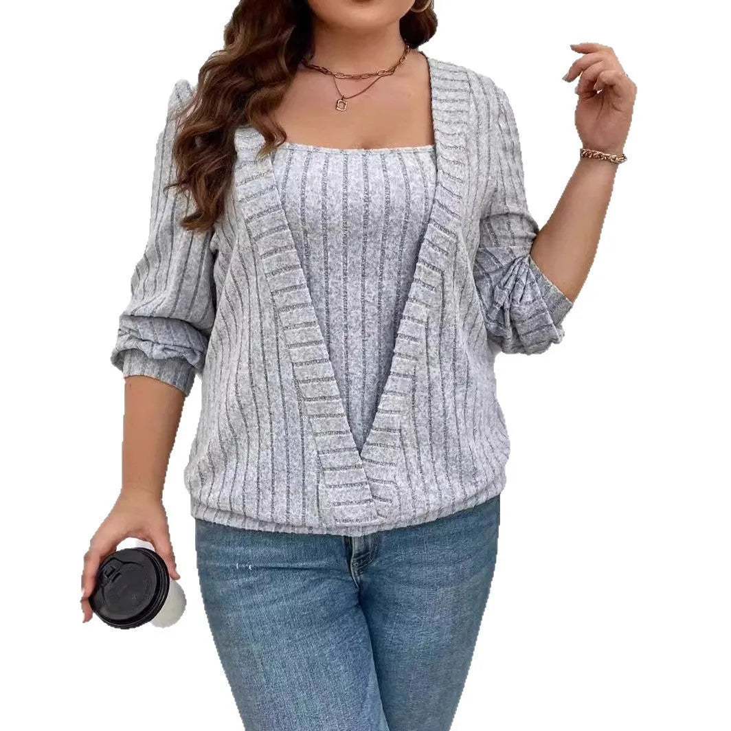 A woman wearing a solid purple rib fabric V-neck false two-piece suit with long sleeves and a loose fit.