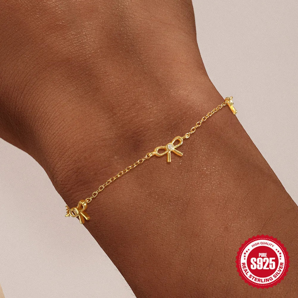 S925 sterling silver bow pendant ear bone stud bracelet necklace jewellery set with gold electroplated finish on O-shaped chain