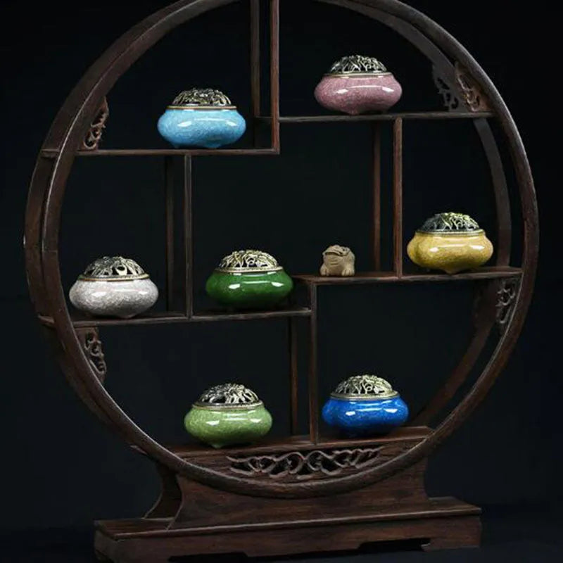 Retro ceramic incense burner in assorted glaze colours on a tabletop