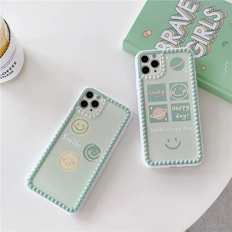 Green iPhone case with geometric smiley face and polka dot patterns, slim TPU back cover design