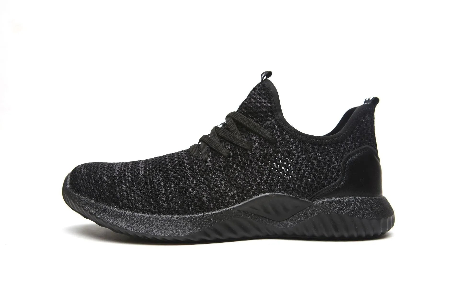 Low-cut black safety shoes with a steel toe cap on a plain background.