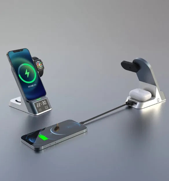 Black six-in-one alarm clock and wireless charging station on a desk.