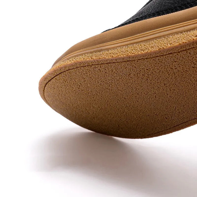 Men's black casual leather shoes with round toe and rubber soles displayed alongside white colour option