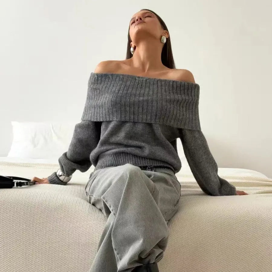 Grey off-the-shoulder women's sweater with a 3D pattern and regular sleeves on a hanger.