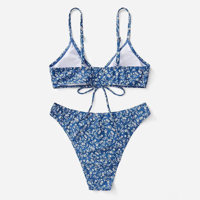 Blue women's swimsuit three-piece set with a top and shorts on a mannequin.