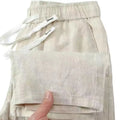 Chinese-style straight leg linen trousers with a drawstring elastic waist in five colour options.