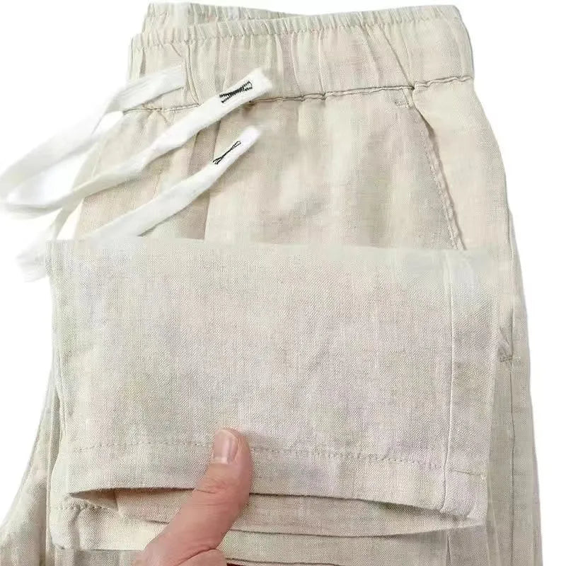 Chinese-style straight leg linen trousers with a drawstring elastic waist in five colour options.