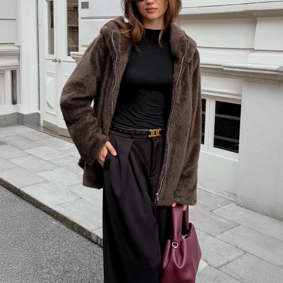Women's brown polyester coat with fur collar, long sleeves, and regular fit on display