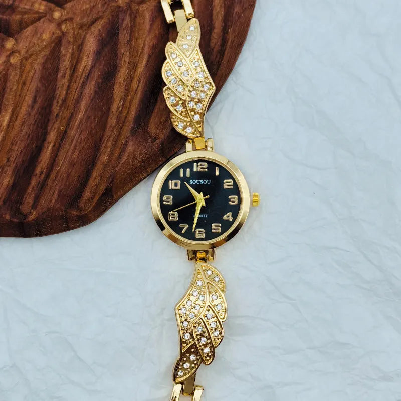 Women's stainless steel watch with gold face round dial and vachette clasp buckle