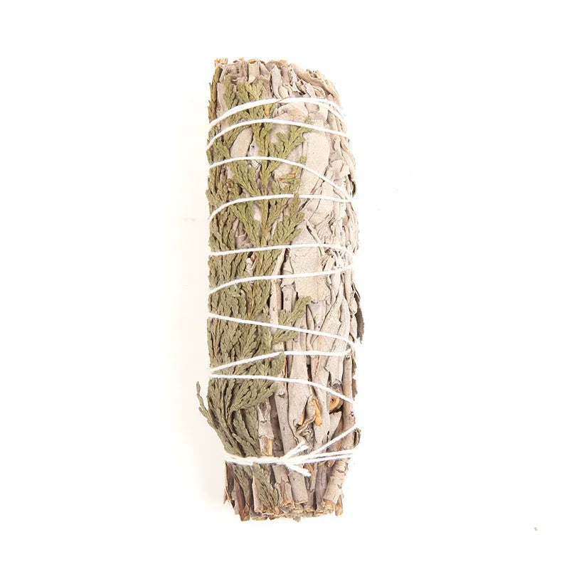 White sage and red rose petal colourful aromatherapy incense bundle on a wooden table