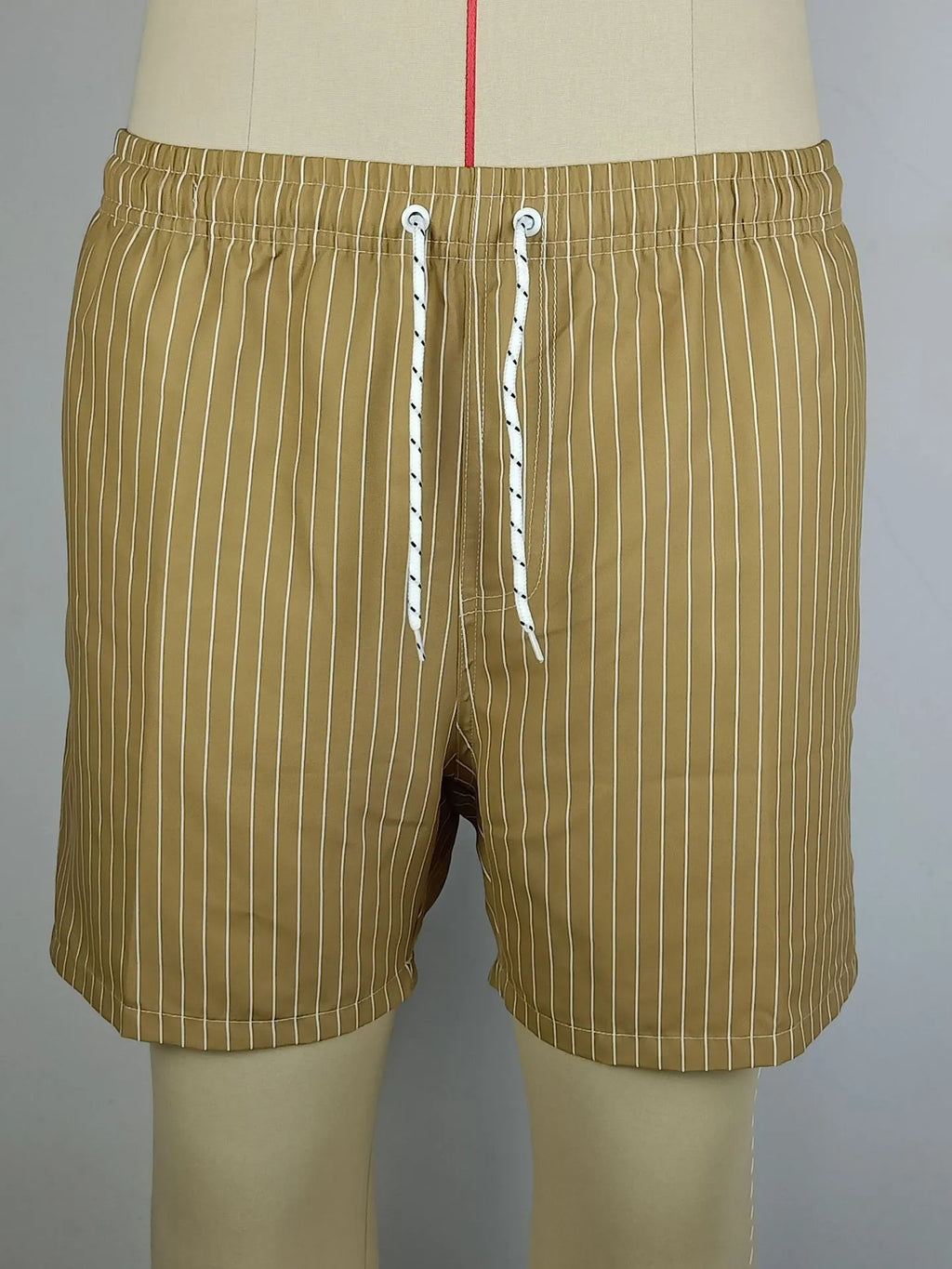 Men's striped polyester shorts in navy blue on a mannequin, showing straight leg design.
