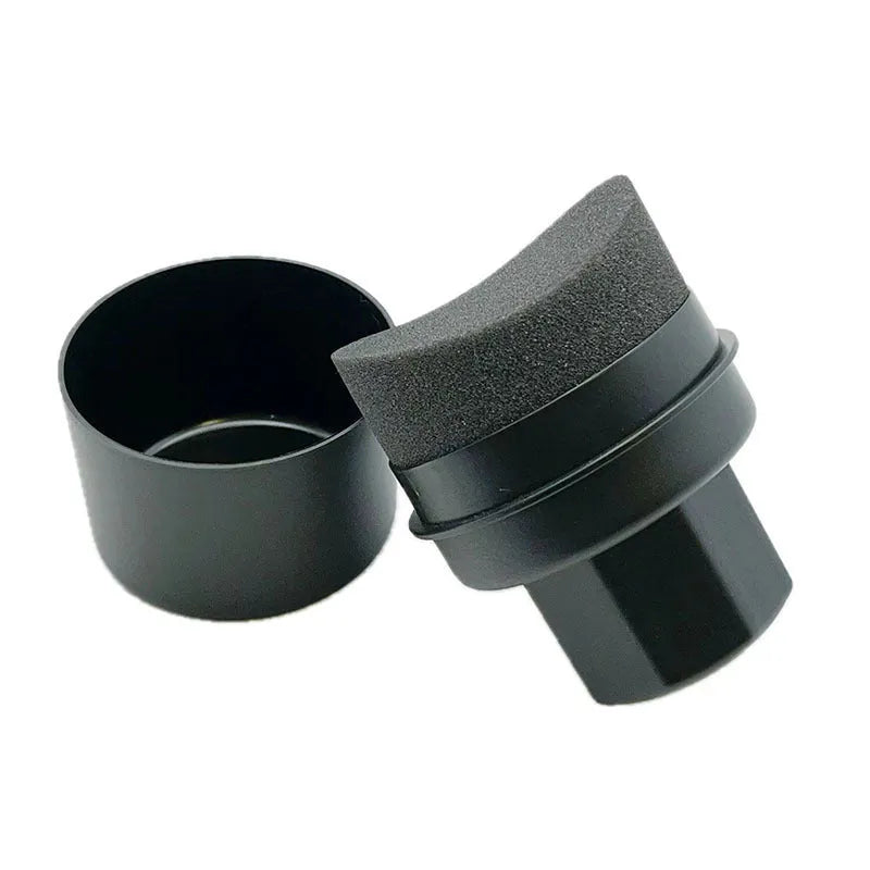 Hand-held black car tyre polishing sponge brush with a lid, showing its compact size and sponge head.