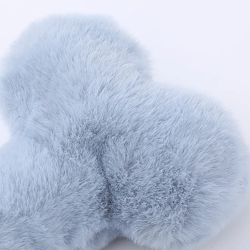 Bone-shaped plush dog toy with hearts and 'Love' text, containing squeaker for interactive pet play