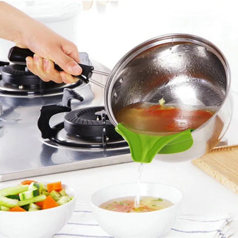 Green silicone kitchen funnel with clamp for round pots on kitchen counter