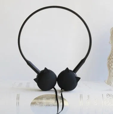 Cute cat stereo earphones with cat ear design in a choice of colours on a plain background