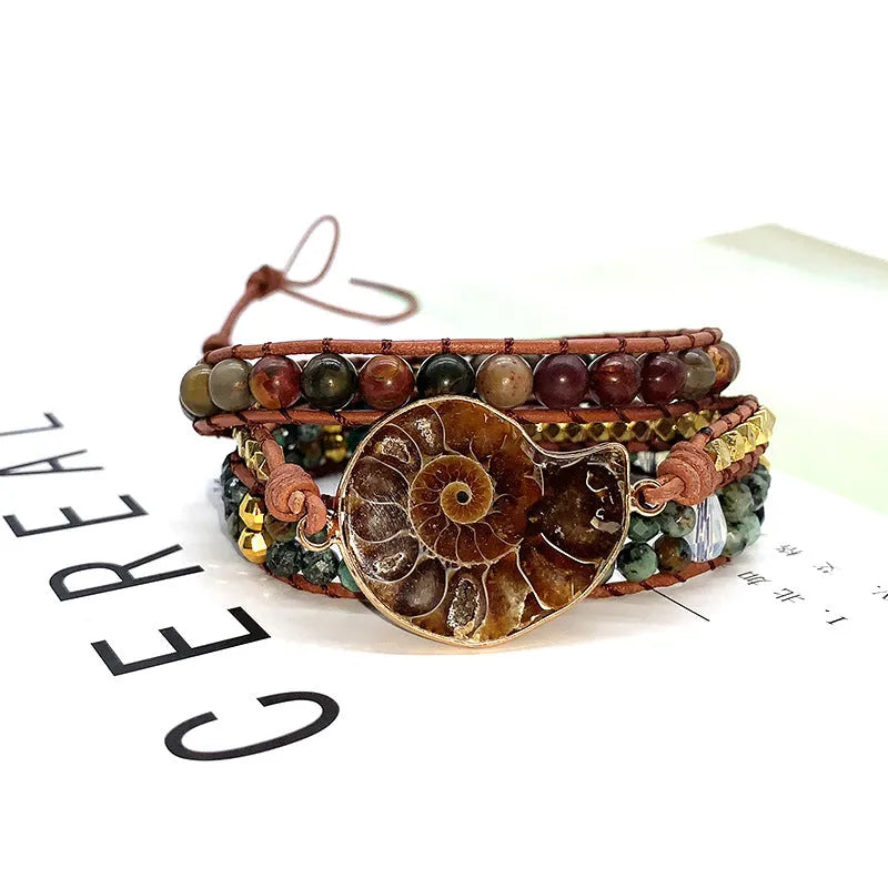 Natural stone bohemian conch bracelet in picture colour on a light background